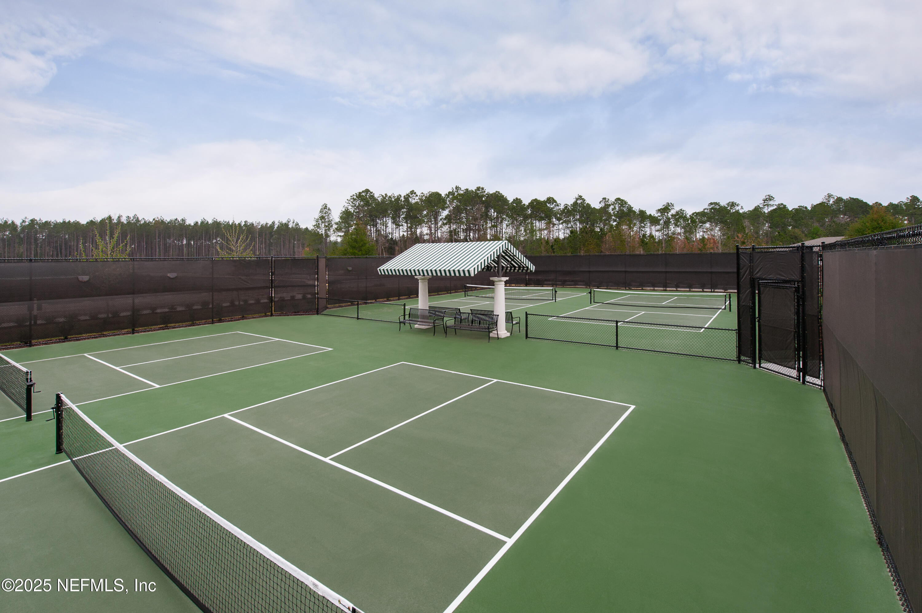 75729 Walking Path Lane Yulee, FL 32097 - Photo 12 of 40 a view of a tennis court