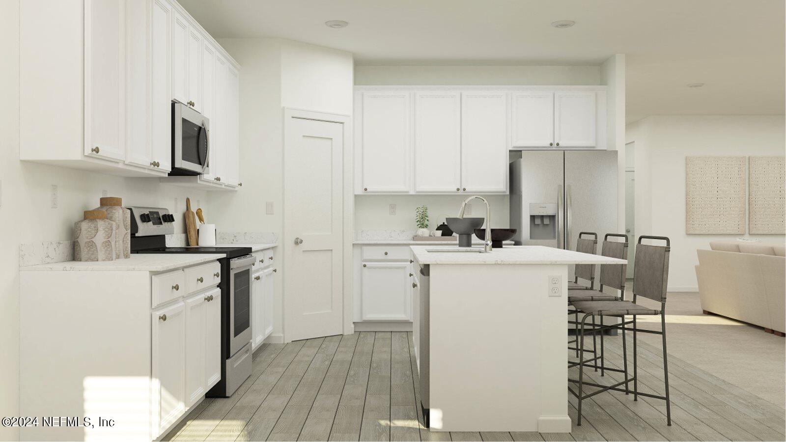 75729 Walking Path Lane Yulee, FL 32097 - Photo 20 of 40 a kitchen with white cabinets and stainless steel appliances