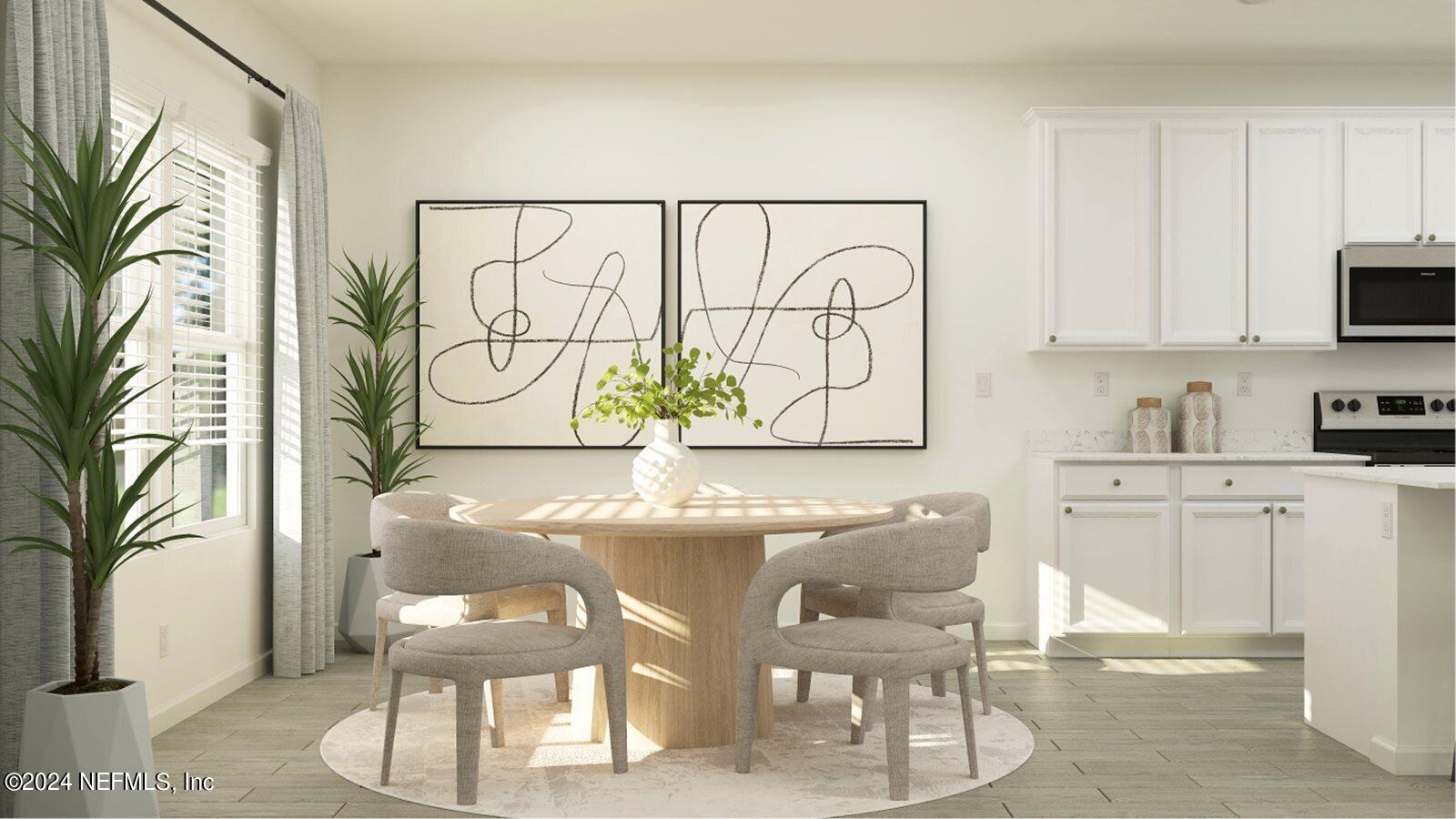 75729 Walking Path Lane Yulee, FL 32097 - Photo 22 of 40 a kitchen with stainless steel appliances kitchen island granite countertop a table and chairs in it