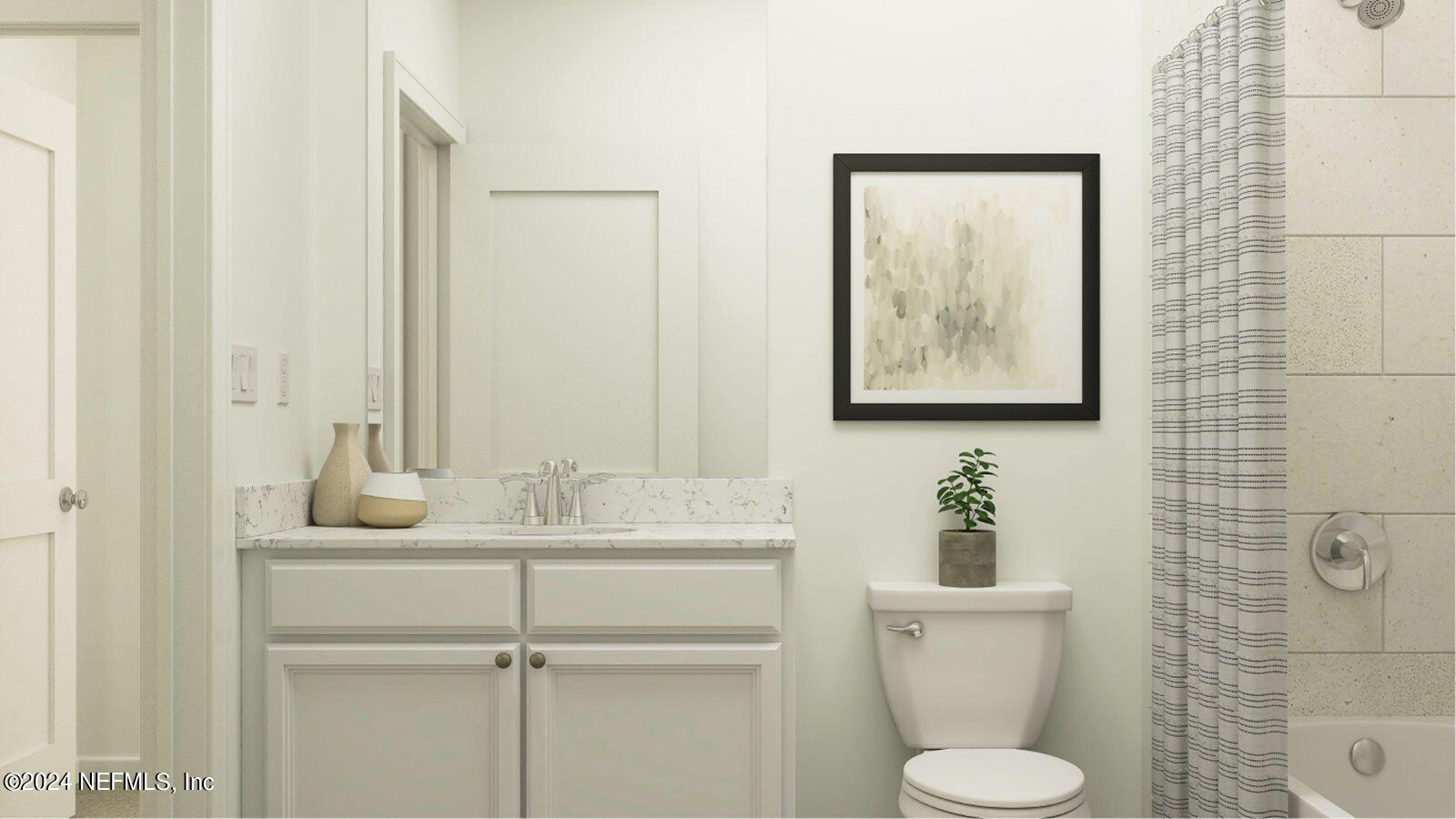 75729 Walking Path Lane Yulee, FL 32097 - Photo 27 of 40 a bathroom with a toilet sink and mirror