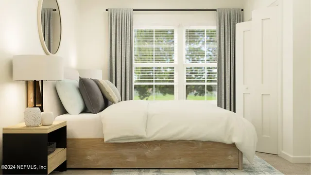 a bedroom with a bed a mirror and wall painting