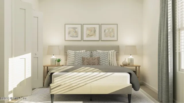 a large bed sitting in a bedroom next to a window