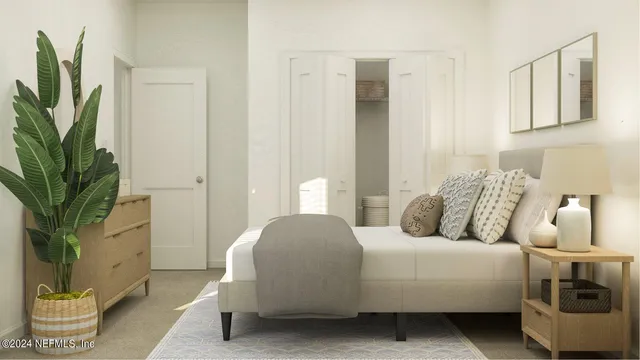 a bedroom with a bed and a table