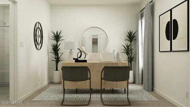 a bedroom with bed and a potted plant