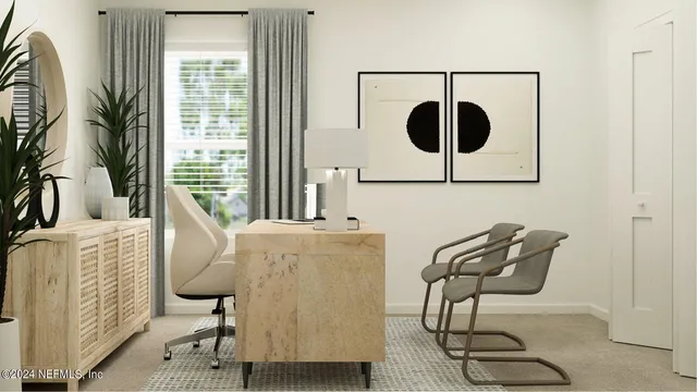 a view of a workspace with furniture