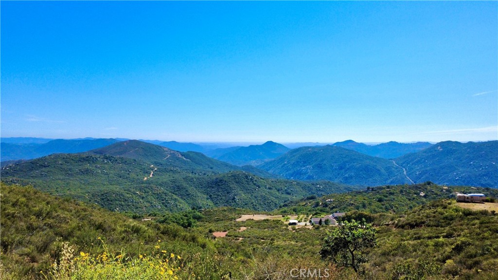0 Sunset Peak Pala, CA 92059 - Photo 15 of 17 a view of a lush green field with lots of bushes
