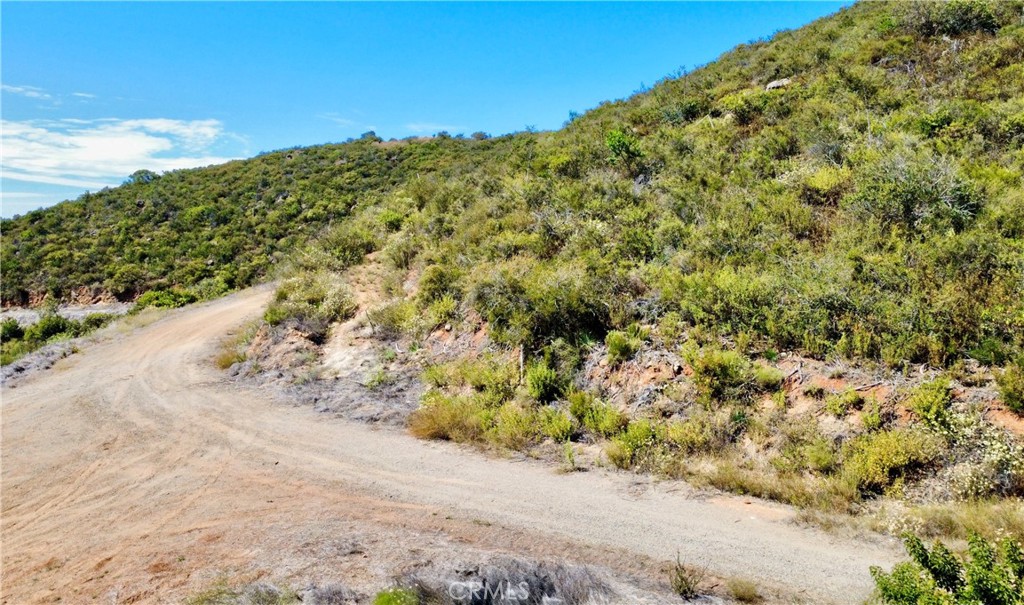 0 Sunset Peak Pala, CA 92059 - Photo 16 of 17 a view of a road with a yard