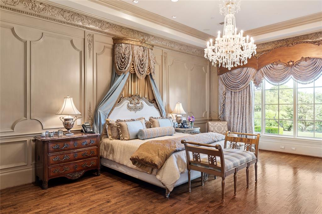 1201 Gray Branch Road McKinney, TX 75071 - Photo 16 of 40 a bedroom with bed and a chandelier