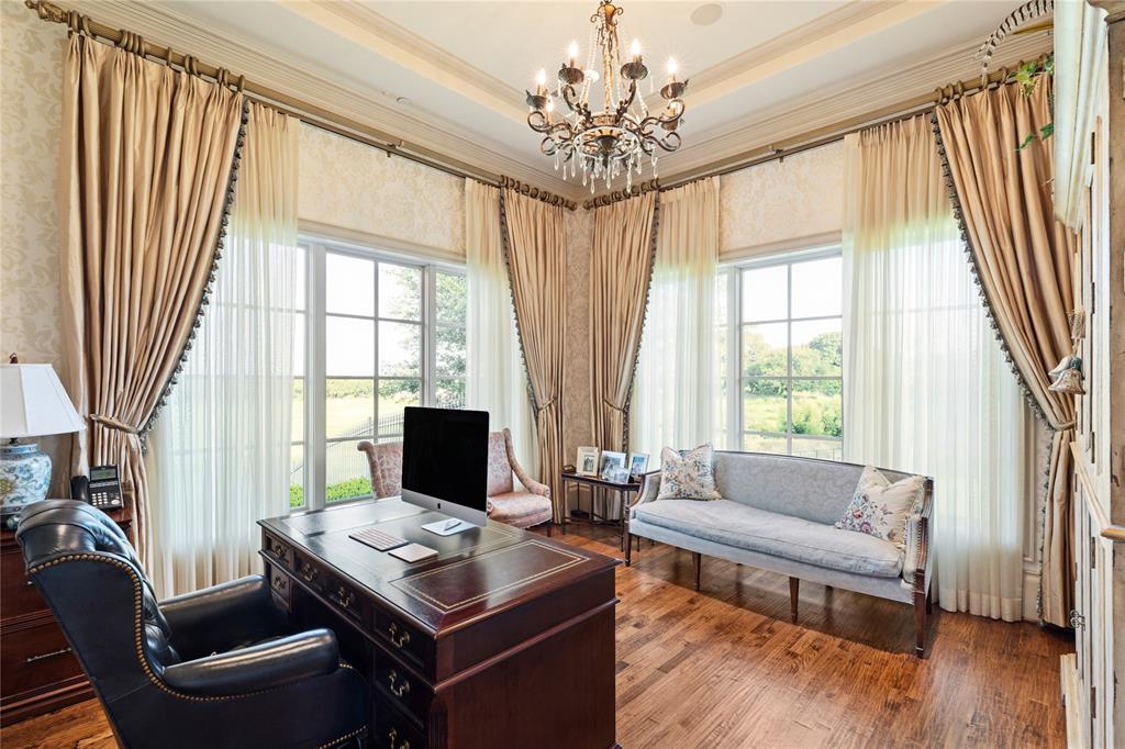 1201 Gray Branch Road McKinney, TX 75071 - Photo 22 of 40 a living room with furniture and a chandelier