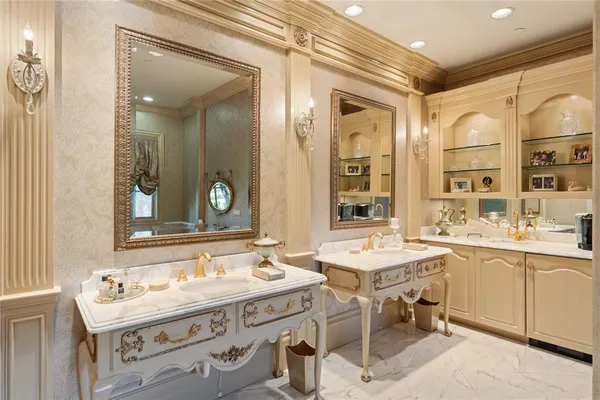 a bathroom with a double vanity sink mirror and