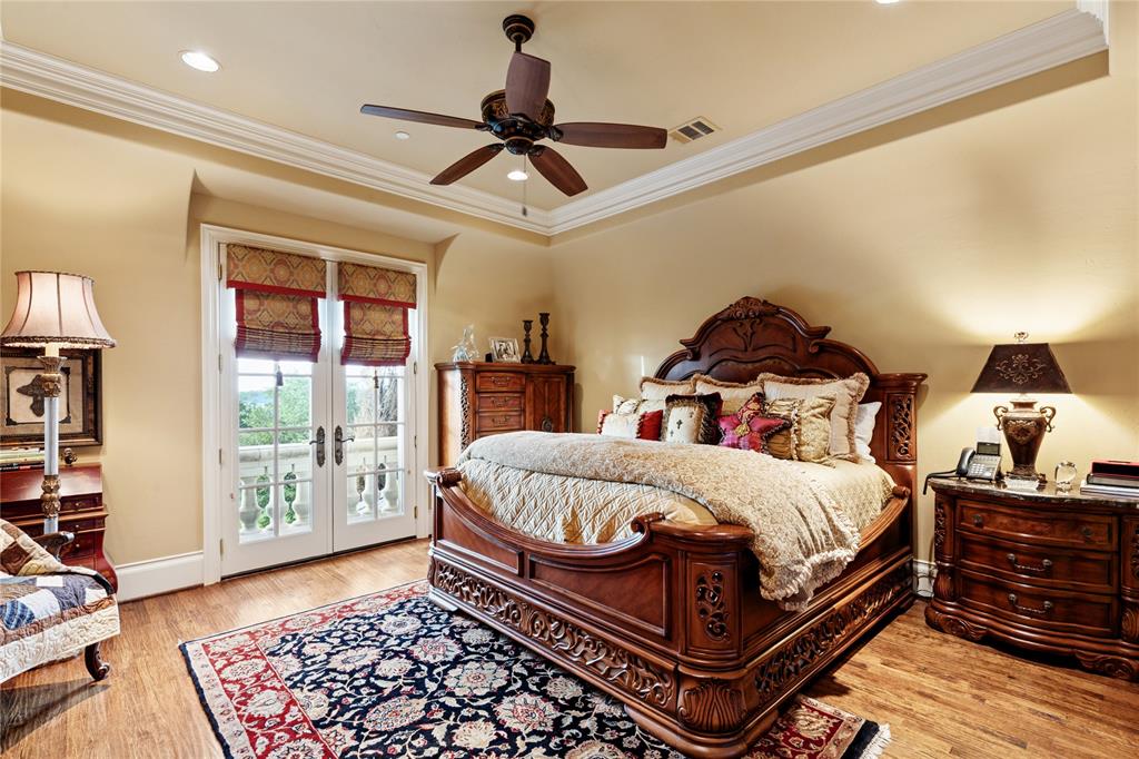 1201 Gray Branch Road McKinney, TX 75071 - Photo 32 of 40 a bedroom with a bed and wooden floor