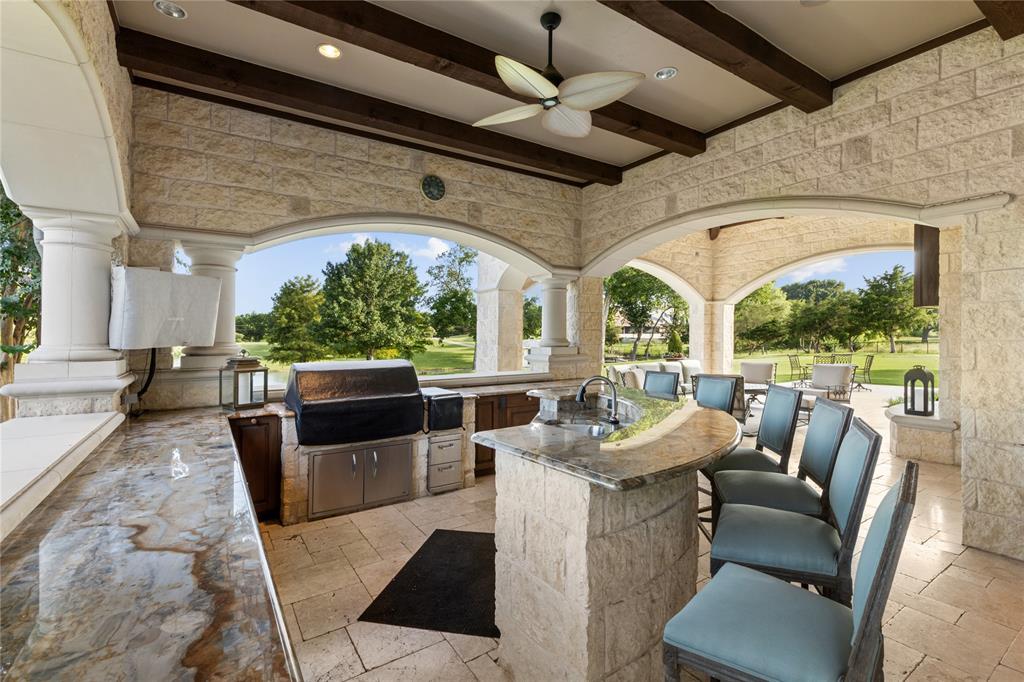 1201 Gray Branch Road McKinney, TX 75071 - Photo 35 of 40 a living room with patio furniture and a floor to ceiling window