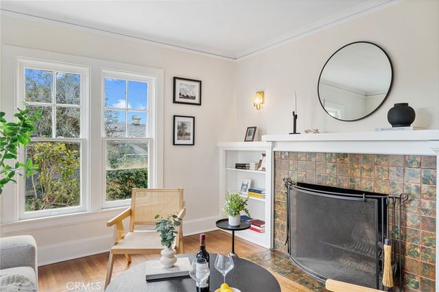a living room with furniture a window and a fireplace