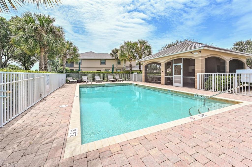 6821 Ascot Drive, Unit 202 Naples, FL 34113 - Photo 21 of 35 a view of a house with backyard and sitting area