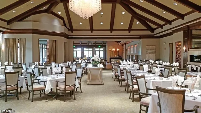 a room with lots of tables and chairs