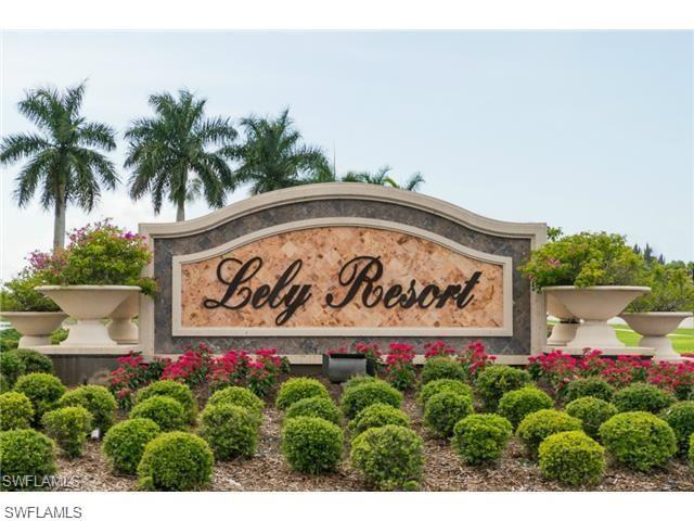 6821 Ascot Drive, Unit 202 Naples, FL 34113 - Photo 33 of 35 a sign that is sitting in front of flowers