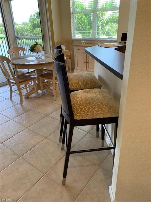 6821 Ascot Drive, Unit 202 Naples, FL 34113 - Photo 6 of 35 a view of a living room and furniture