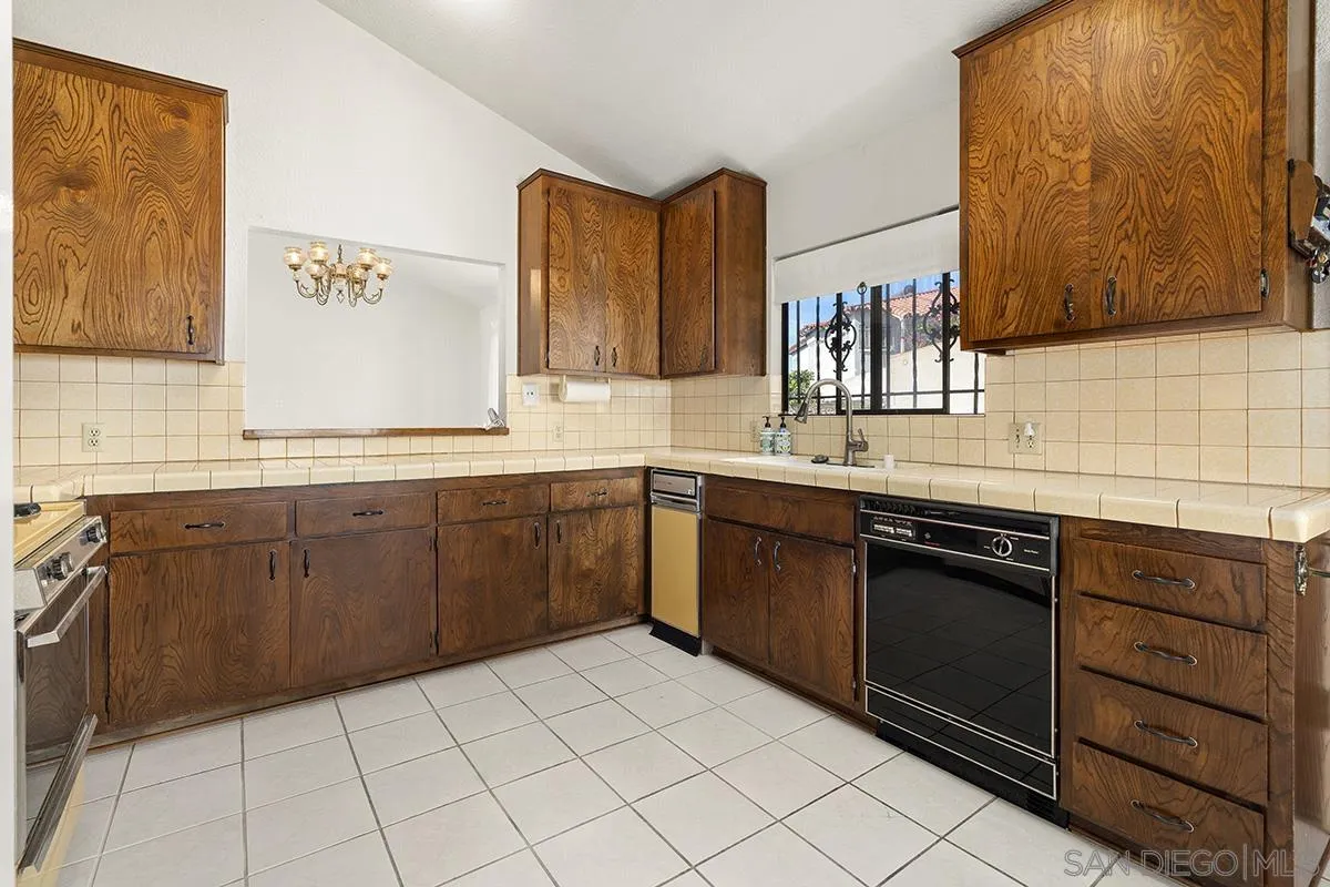 3344 Goldfinch Street San Diego, CA 92103 - Photo 15 of 41 a kitchen with a sink stove and cabinets