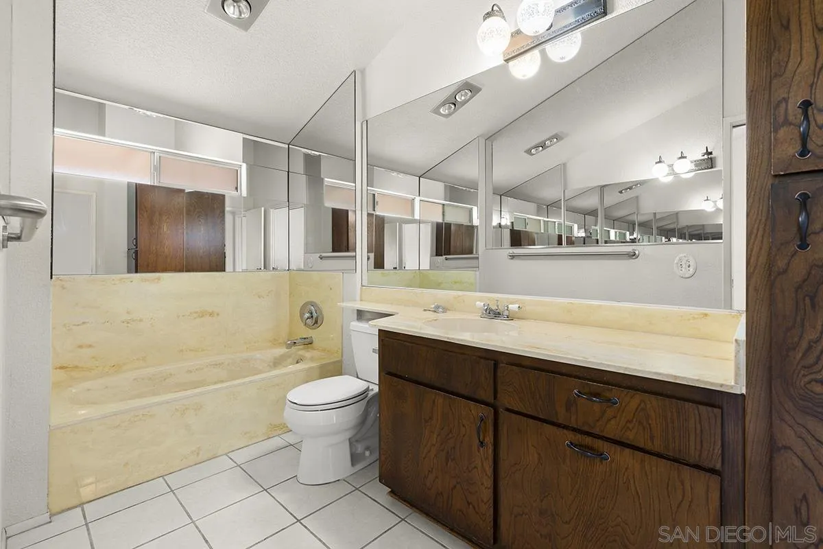 3344 Goldfinch Street San Diego, CA 92103 - Photo 25 of 41 a bathroom with a sink a toilet and shower