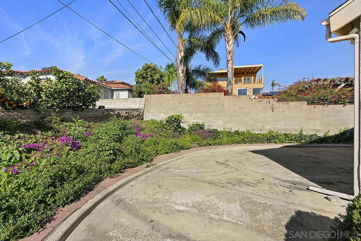 3344 Goldfinch Street San Diego, CA 92103 - Photo 38 of 41 a front view of a house with a yard and potted plants