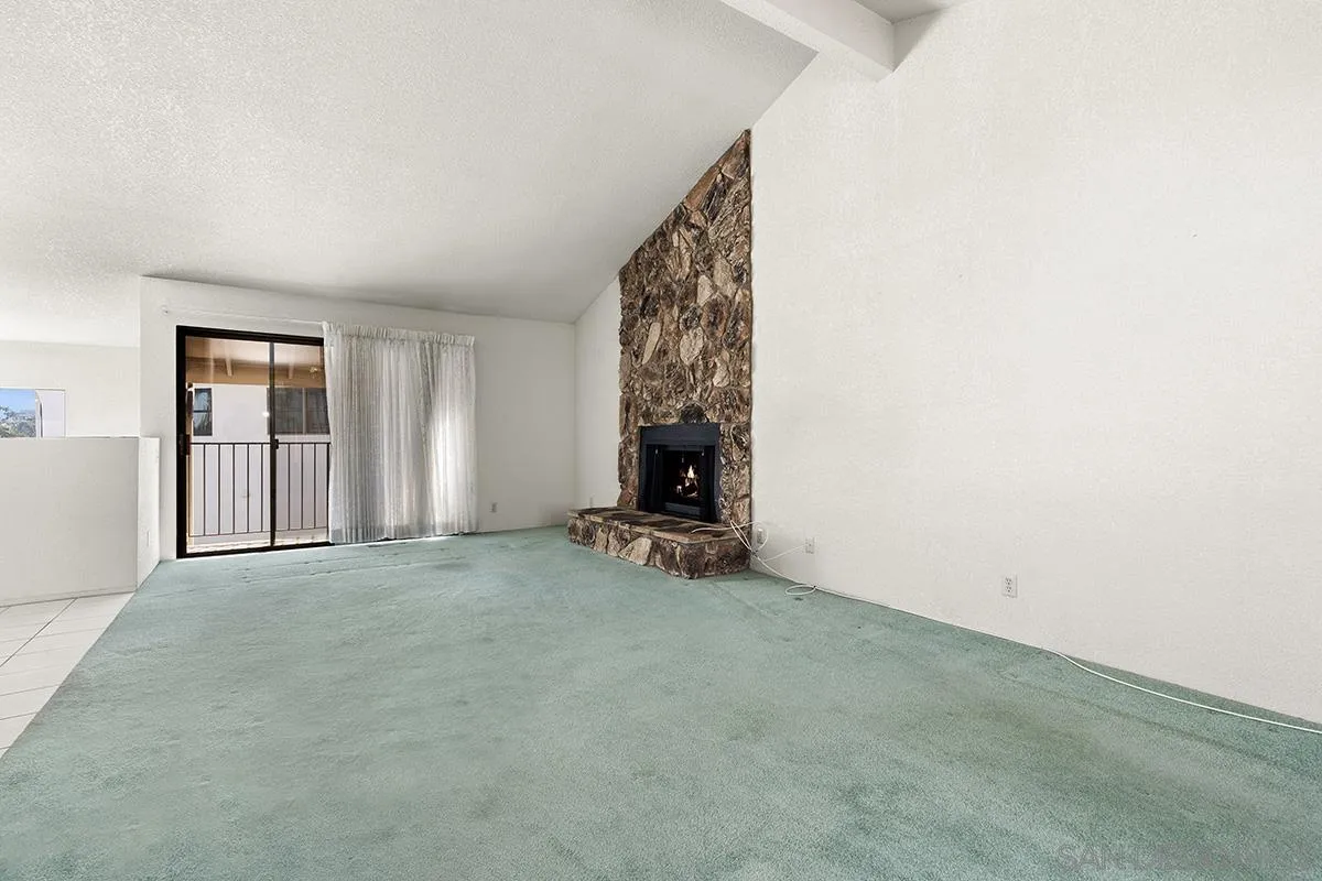 3344 Goldfinch Street San Diego, CA 92103 - Photo 9 of 41 a view of an empty room with fireplace and workspace