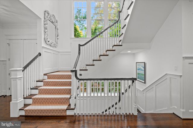 a living room with furniture fireplace and window