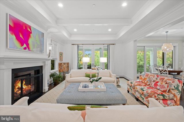 a living room with furniture fireplace and window