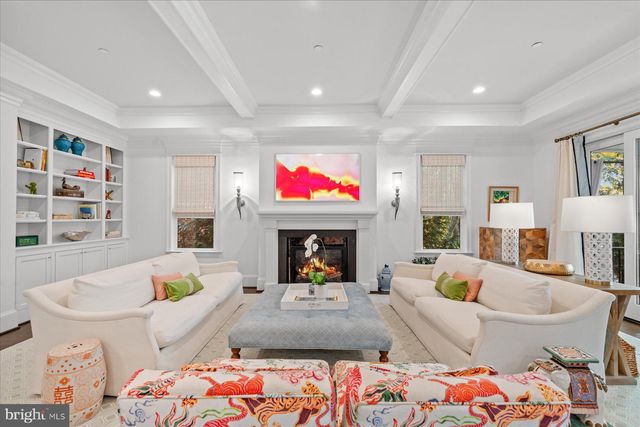 a spacious bathroom with a shower a toilet and a window