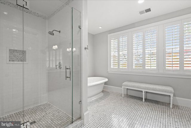 a view of entryway with wooden floor and stairs