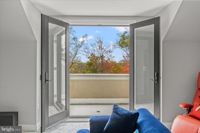 a view of a chairs and table in the balcony
