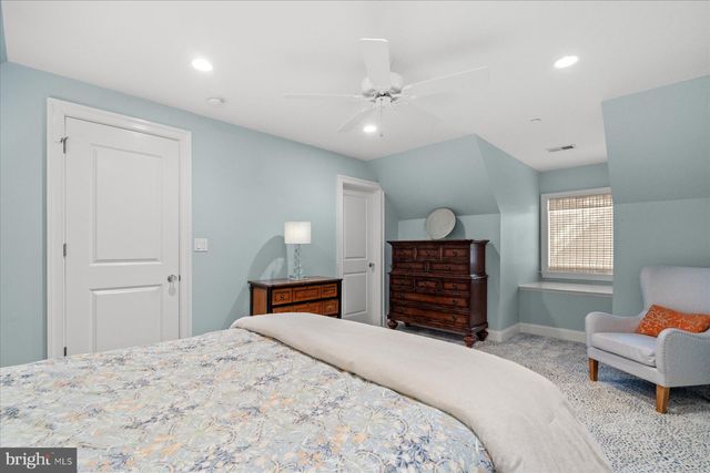 a view of a cafe with a table and chairs in patio