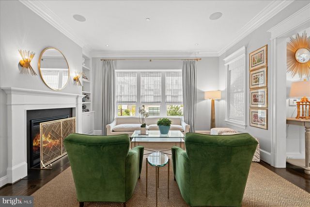a view of a kitchen with a sink dishwasher and wooden floor