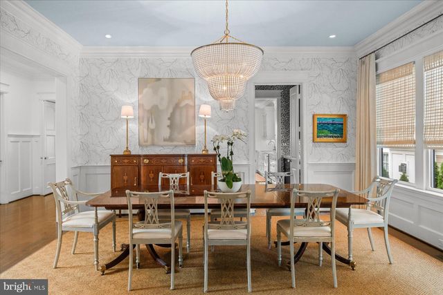 a kitchen with a table and chairs in it