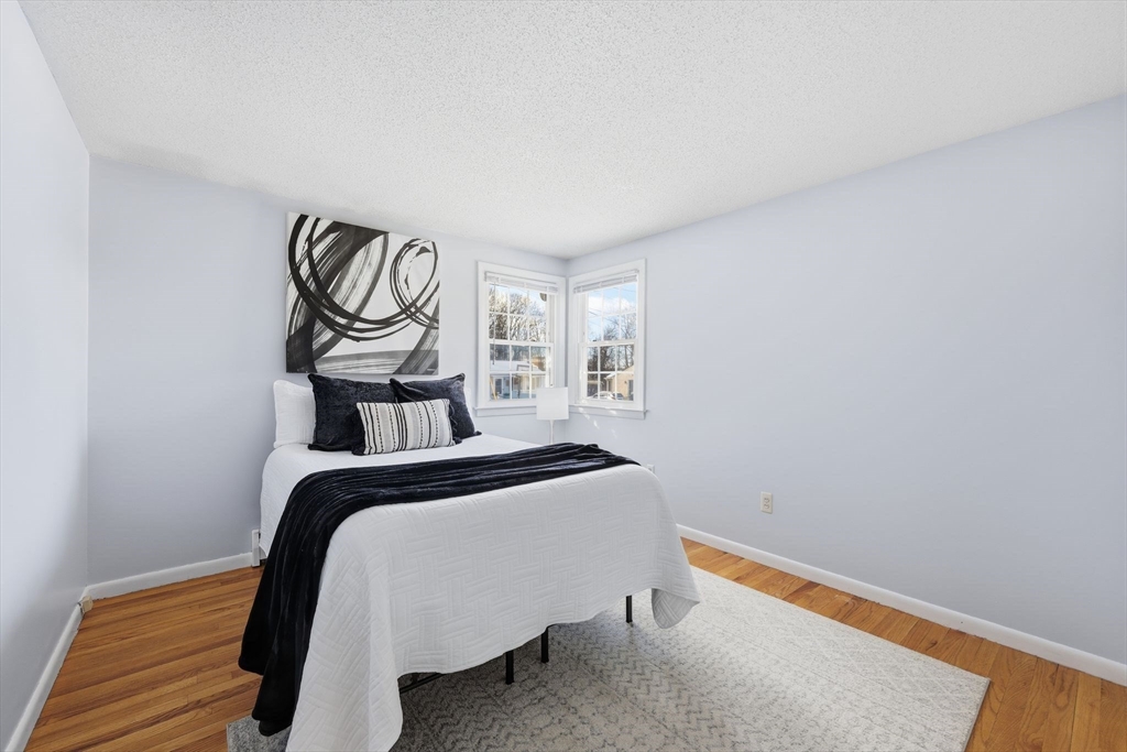176 Silvin Road Chicopee, MA 01013 - Photo 14 of 32 a bedroom with a bed and painting on the wall