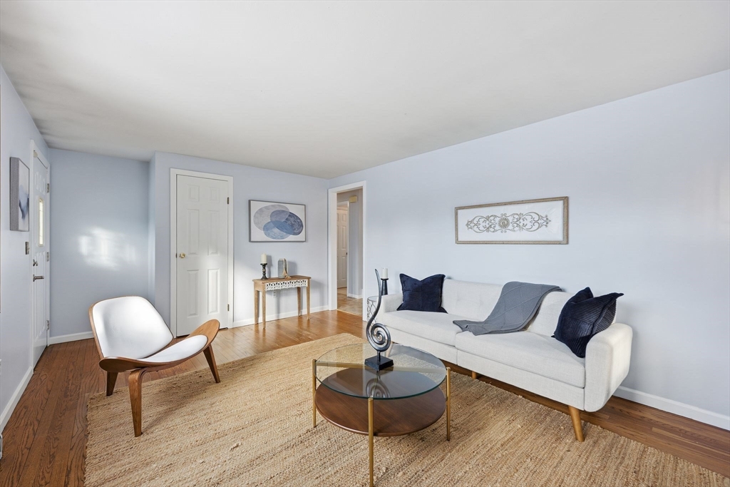 176 Silvin Road Chicopee, MA 01013 - Photo 2 of 32 a living room with furniture and wooden floor