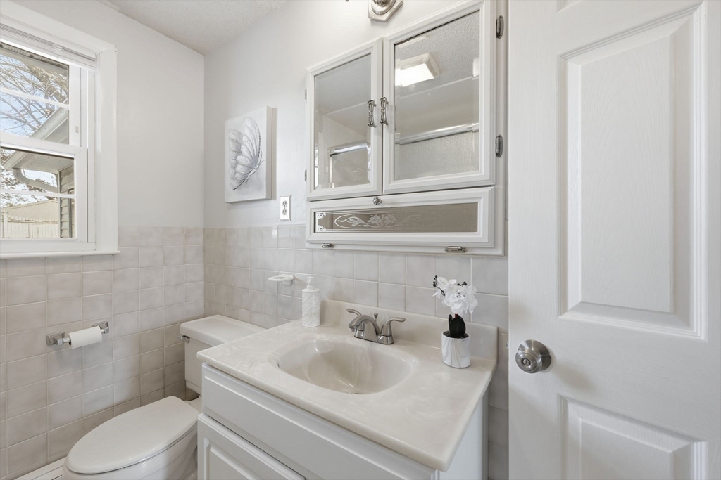 176 Silvin Road Chicopee, MA 01013 - Photo 21 of 32 a bathroom with a sink toilet and vanity