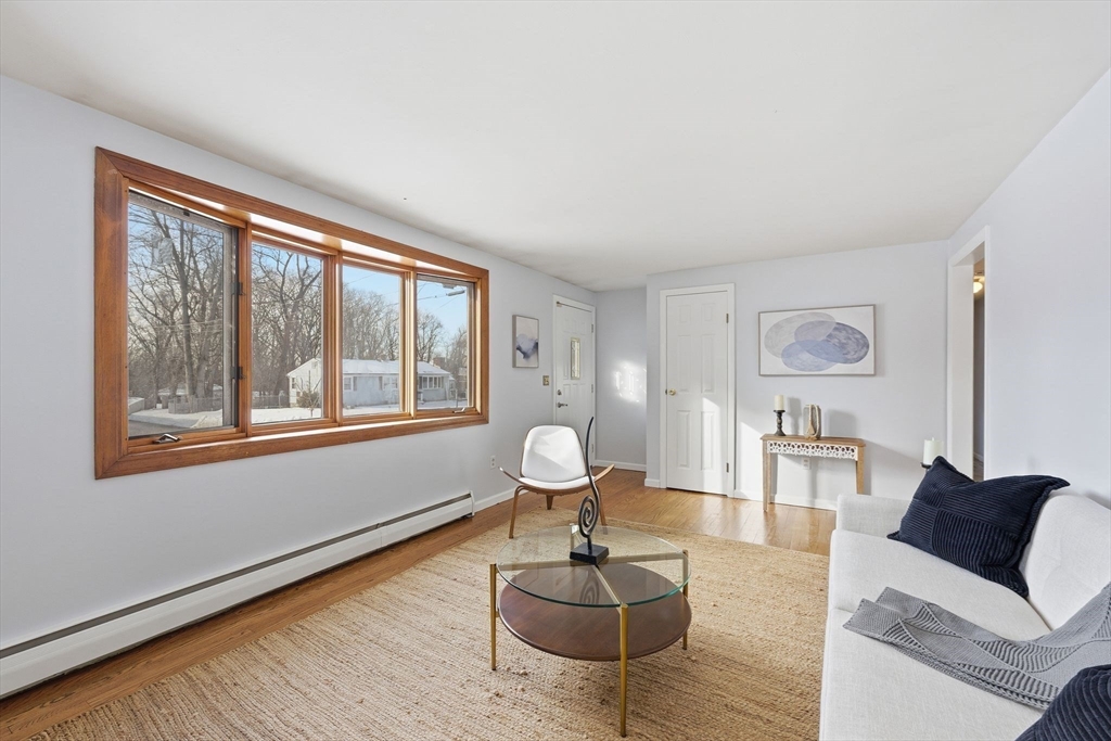 176 Silvin Road Chicopee, MA 01013 - Photo 3 of 32 a living room with furniture a table and large window