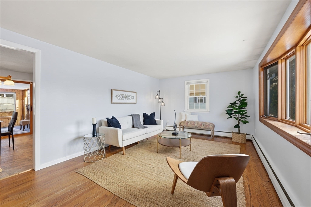 176 Silvin Road Chicopee, MA 01013 - Photo 4 of 32 a living room with furniture large window and wooden floor