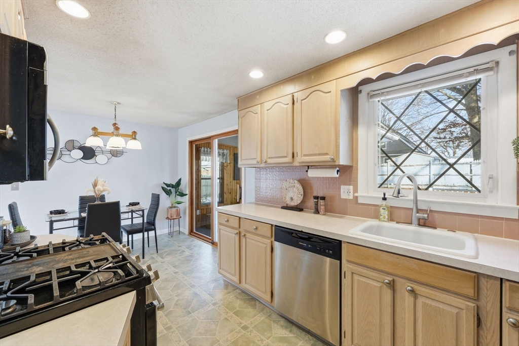 176 Silvin Road Chicopee, MA 01013 - Photo 8 of 32 a kitchen with a sink stove and refrigerator