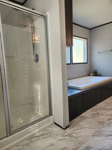 a room with a bath tub and shower