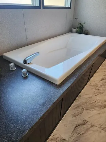 a view of a room with table and chairs