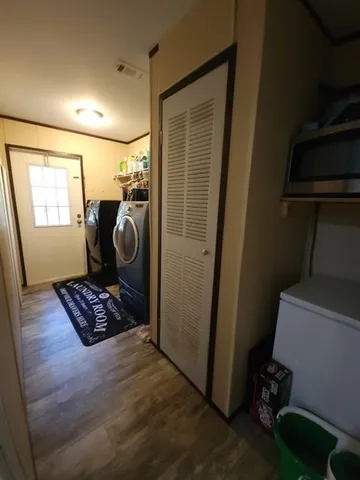 a swimming pool with wooden floor and outdoor space