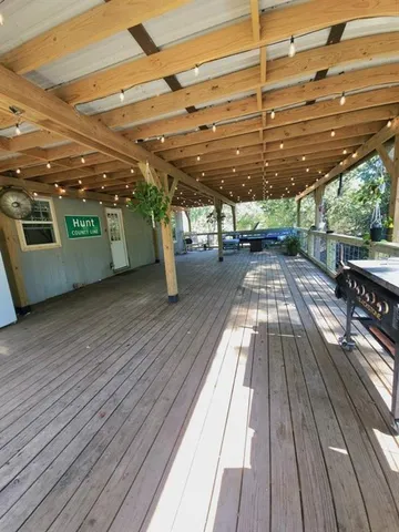 a view of a patio with wooden floor