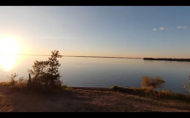 a view of lake with green space