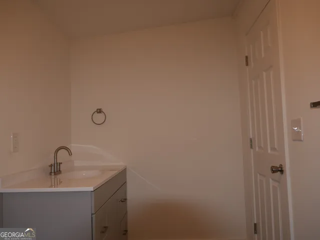a bathroom with a sink and mirror