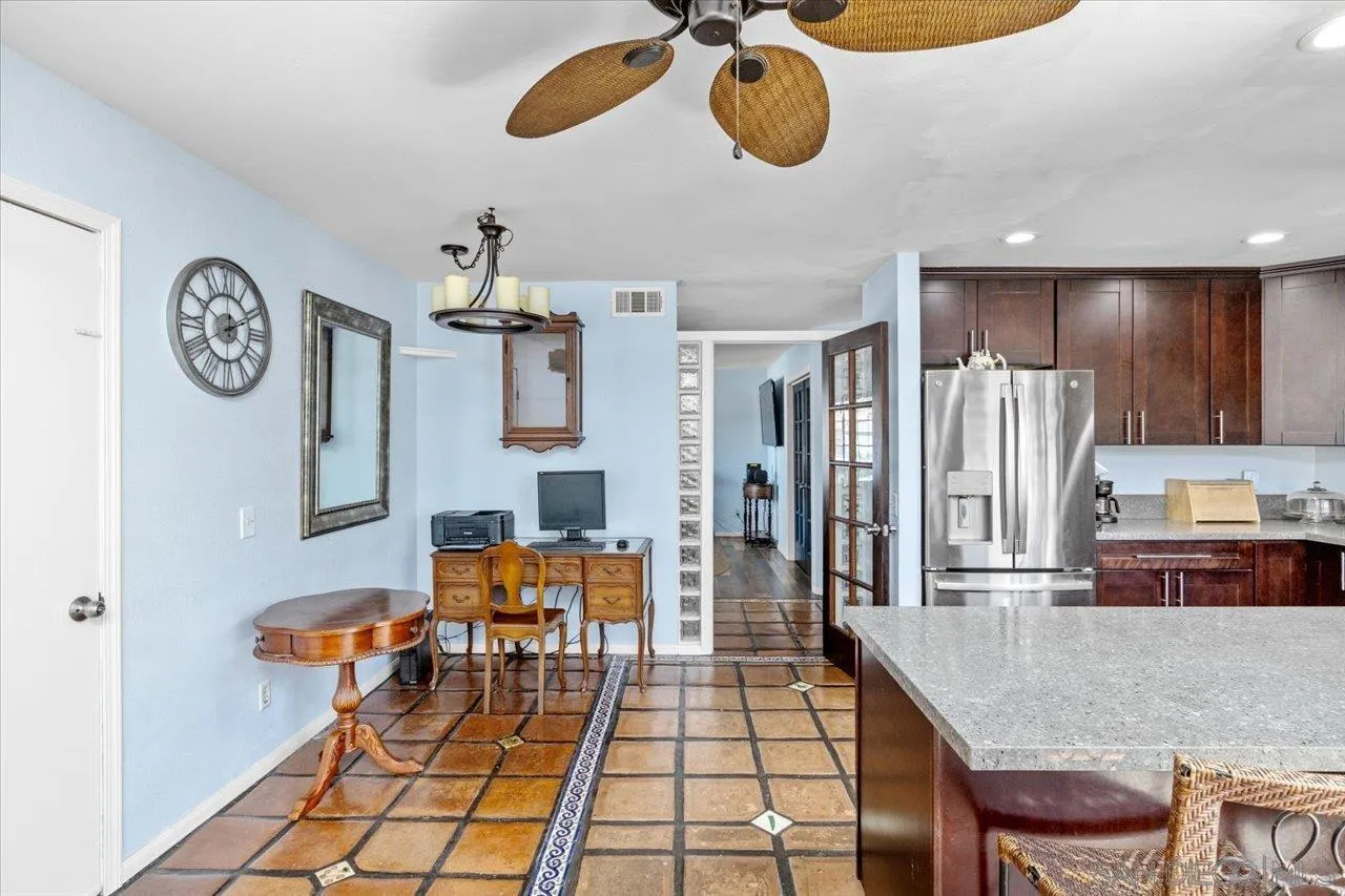 2337 Fallingleaf Road Oceanside, CA 92056 - Photo 12 of 34 a dining room with furniture and chandelier