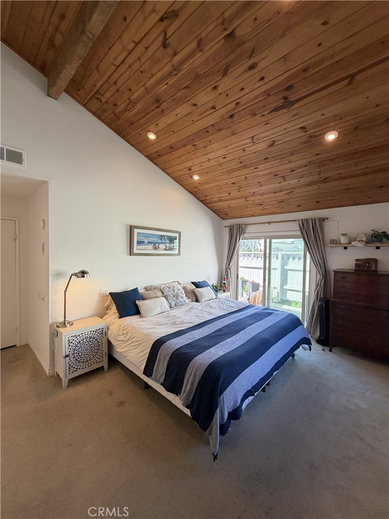 743 Calle Bahia San Clemente, CA 92672 - Photo 2 of 31 a spacious bedroom with a bed couch chandelier and a window