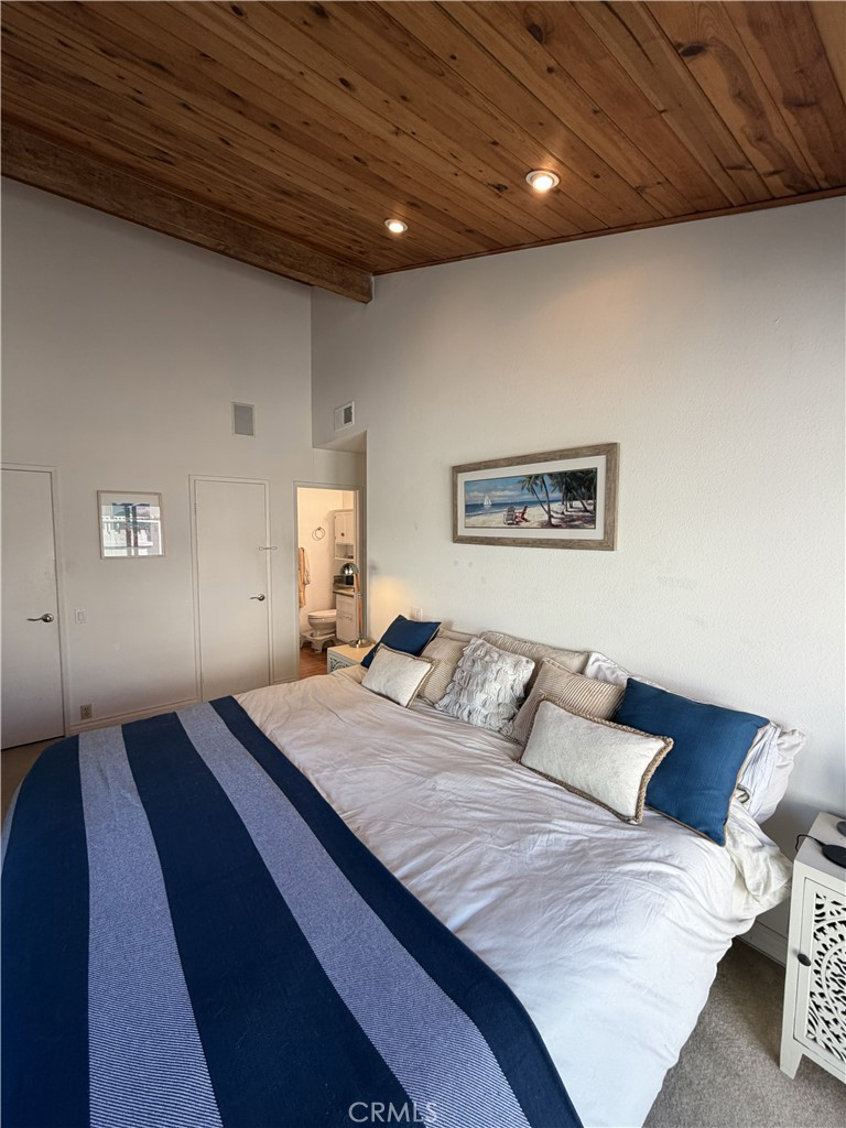 743 Calle Bahia San Clemente, CA 92672 - Photo 7 of 31 a bedroom with a large bed and a wooden floor