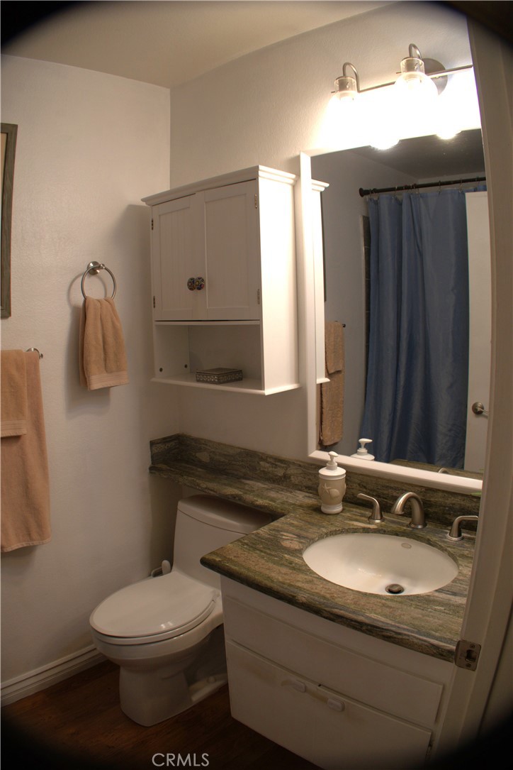 743 Calle Bahia San Clemente, CA 92672 - Photo 8 of 31 a bathroom with a granite countertop sink toilet and mirror