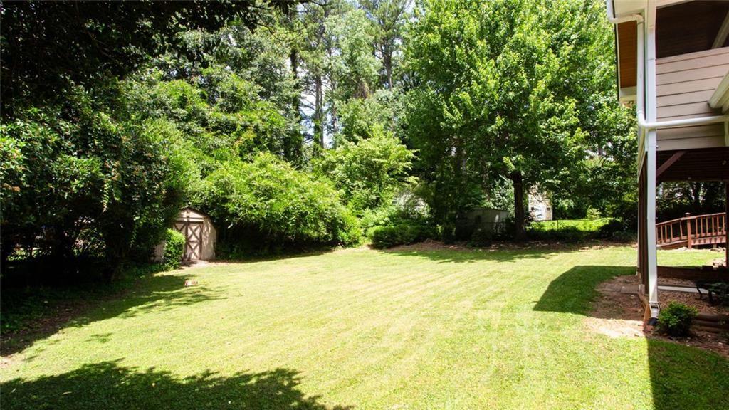 2814 Goodfellows Road Tucker, GA 30084 - Photo 46 of 46 a swimming pool with some trees in the background